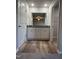 Double vanity bathroom with granite countertops and laminate wood floor at 29 Pate Landing Dr, Selma, NC 27576