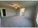 Bright bedroom featuring a ceiling fan and en-suite bathroom access at 29 Pate Landing Dr, Selma, NC 27576