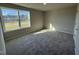 Bright bedroom with neutral carpet and a large window offering natural light at 29 Pate Landing Dr, Selma, NC 27576