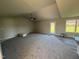 Spacious living room with neutral carpeting, high ceilings, and access to the back patio at 29 Pate Landing Dr, Selma, NC 27576