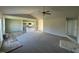 Open concept living area with grey carpeting, kitchen island, and vinyl flooring at 29 Pate Landing Dr, Selma, NC 27576