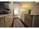 Kitchen with island, stainless steel appliances, and white cabinets at 3130 Rushworth Dr, Raleigh, NC 27609