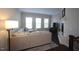 Spacious living room with L-shaped sofa, fireplace, and hardwood floors at 3130 Rushworth Dr, Raleigh, NC 27609