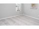 Simple bedroom with carpeted floors and a window overlooking the neighborhood at 3911 Massey Wood Trl, Raleigh, NC 27616