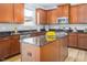 Spacious kitchen with island, stainless steel appliances, and granite countertops at 3911 Massey Wood Trl, Raleigh, NC 27616