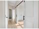 Light hallway with white doors and light brown wood floors at 3940 Nc-581, Kenly, NC 27542