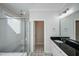 Bathroom with walk-in shower and double vanity at 407 Eagle Ct, Henderson, NC 27536