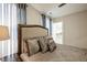 Bright bedroom with a queen-size bed and ensuite access at 407 Eagle Ct, Henderson, NC 27536