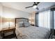 Bright bedroom with double bed, nightstands, and window curtains at 407 Eagle Ct, Henderson, NC 27536