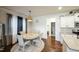 Charming dining area with a round table and four chairs, near kitchen at 407 Eagle Ct, Henderson, NC 27536