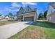 Two-story brick home with a large driveway and landscaped lawn at 407 Eagle Ct, Henderson, NC 27536