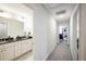 Clean hallway with carpet flooring and access to bedrooms and bath at 407 Eagle Ct, Henderson, NC 27536