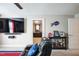 Home theater with seating, large screen TV, and office view at 407 Eagle Ct, Henderson, NC 27536