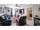 Home theater with seating, large screen TV, and game room at 407 Eagle Ct, Henderson, NC 27536