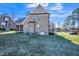 Brick house exterior with a screened porch and yard at 407 Eagle Ct, Henderson, NC 27536