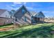 Brick house exterior with a screened porch and yard at 407 Eagle Ct, Henderson, NC 27536