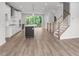 Open concept kitchen with island and hardwood floors at 4505 Mint Leaf Ln, Raleigh, NC 27612