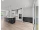 Open concept kitchen with island and hardwood floors at 4505 Mint Leaf Ln, Raleigh, NC 27612