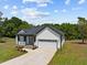 White house with gray roof and two-car garage at 55 Sterling Dr, Franklinton, NC 27525