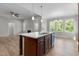 Modern kitchen features island with sink and breakfast bar at 55 Sterling Dr, Franklinton, NC 27525