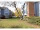 Condo building exterior with walkway and landscaping at 1081 Wirewood Dr # 302, Raleigh, NC 27605