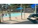 Refreshing community pool with a gated entrance, picnic tables, and shade structures at 109 Lone Star Dr, Louisburg, NC 27549