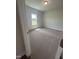 Bright bedroom featuring carpet flooring and a window at 120 Lemon Drop Ln, Franklinton, NC 27525