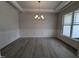 Formal dining room with chandelier, wainscoting, and large windows at 120 Lemon Drop Ln, Franklinton, NC 27525