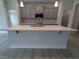 Large kitchen island with white quartz countertop and gray cabinets at 120 Lemon Drop Ln, Franklinton, NC 27525