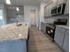 Modern kitchen with stainless steel appliances and gray cabinets at 120 Lemon Drop Ln, Franklinton, NC 27525