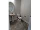 Convenient powder room with pedestal sink and gray tile floor at 120 Lemon Drop Ln, Franklinton, NC 27525