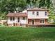 Brick house exterior with a spacious lawn and mature trees at 1217 Pond St, Cary, NC 27511