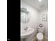 Small half bathroom with pedestal sink and toilet at 1217 Pond St, Cary, NC 27511