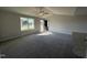 Spacious living room with neutral carpeting and large windows at 131 Pate Landing Dr, Selma, NC 27576