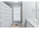 Clean bathroom with a white ruffled shower curtain and single vanity at 170 Carrington Ave, Franklinton, NC 27525