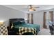 Spacious bedroom with dark-brown headboard and green bedding at 170 Carrington Ave, Franklinton, NC 27525