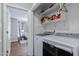 Laundry room with washer, dryer, and shelving at 170 Carrington Ave, Franklinton, NC 27525