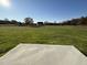 Spacious backyard with a large grassy area and open views at 186 Pate Landing Dr, Selma, NC 27576