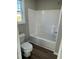 Clean bathroom with a shower/tub combo and vinyl flooring at 186 Pate Landing Dr, Selma, NC 27576