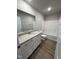 Bathroom with white vanity, granite countertop, and bathtub at 186 Pate Landing Dr, Selma, NC 27576