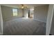 Bright bedroom featuring a large window and plush carpeting at 186 Pate Landing Dr, Selma, NC 27576