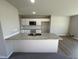 Kitchen boasts granite countertops and a breakfast bar at 186 Pate Landing Dr, Selma, NC 27576