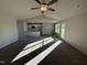 Open-concept living room with a view into the kitchen area at 186 Pate Landing Dr, Selma, NC 27576