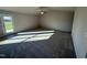 Bright living room featuring gray carpet and access to a patio at 186 Pate Landing Dr, Selma, NC 27576