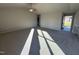 Spacious living room with gray carpet and lots of natural light at 186 Pate Landing Dr, Selma, NC 27576
