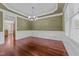 Formal dining room with hardwood floors, chair railing, and a chandelier at 2124 Karns Pl, Raleigh, NC 27614