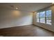 Bright living room with hardwood floors and large windows overlooking the neighborhood at 2347 Whitewing Ln, Wendell, NC 27591