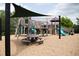 Wooden play structure with shade sail and picnic table at 2347 Whitewing Ln, Wendell, NC 27591