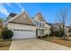 Two-story house with a two-car garage and well-maintained lawn at 237 Sweet Violet Dr, Holly Springs, NC 27540