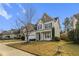 Two-story house with a neutral color scheme and a nicely landscaped yard at 237 Sweet Violet Dr, Holly Springs, NC 27540